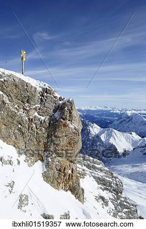 Stock Photo - "Mt. Zugspitze, 2962m, with the summit cross restored in 2009, Wettersteingebirge mountains, Werdenfels, Upper Bavaria, Bavaria, Germany, Europe". Fotosearch
