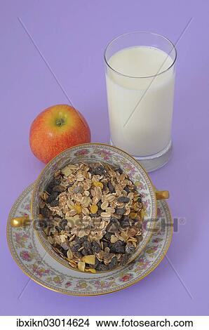 "Muesli or cereal in a soup bowl, glass of milk and an apple" View Large Photo Image Picture - "Muesli or cereal in a soup bowl, glass of milk and an apple". Fotosearch