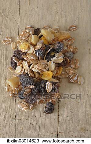 Muesli or cereal on an old wooden board View Large Photo Image Stock Image - Muesli or cereal on an old wooden board. Fotosearch