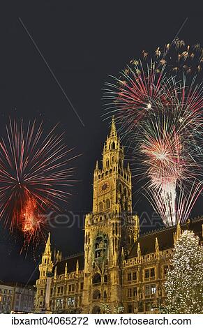 Stock Image - "Munich City Hall, Marienplatz square, with New Year's fireworks, Munich, Upper Bavaria, Bavaria, Germany, Europe". Fotosearch