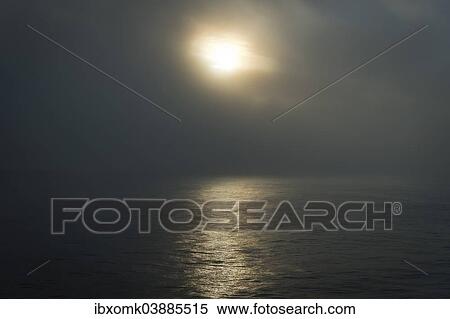 Stock Photography - "Mystical atmosphere, sun behind clouds, Arctic Ocean, Spitsbergen, Svalbard archipelago, Svalbard and Jan Mayen, Norway, Europe". Fotosearch