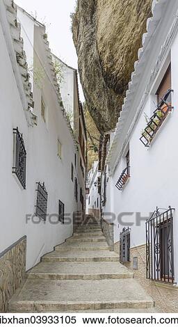"Narrow alley with rock wall, Setenil de las Bodegas, Andalucia, Spain, Europe" View Large Photo Image Stock Photography - "Narrow alley with rock wall, Setenil de las Bodegas, Andalucia, Spain, Europe". Fotosearch