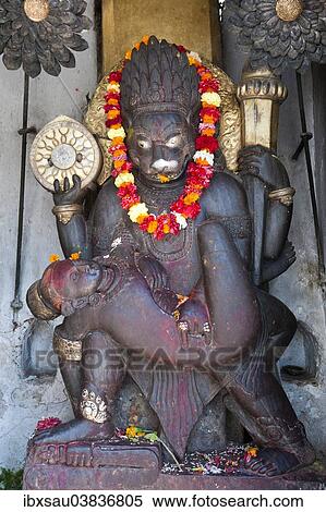 Stock Photography - "Narsingha stone statue, demon, Great Protector, at the entrance to the Hanuman Dhoka Royal Palace, Kathmandu, Kathmandu Valley, Nepal, Asia". Fotosearch