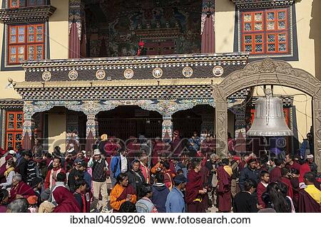 Stock Photograph - "Native people in front of the Cinya Llama Gompa, Boudhanath, UNESC World Heritage Site, Kathmandu, Nepal, Asia". Fotosearch
