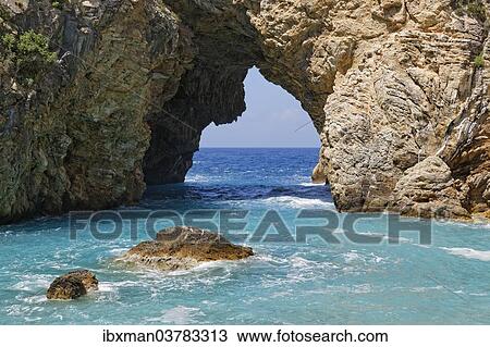 Stock Image - "Natural arch, coast in Antiochia ad Cragum, Turkish Riviera, Gazipasa, Antalya Province, Turkey, Asia". Fotosearch