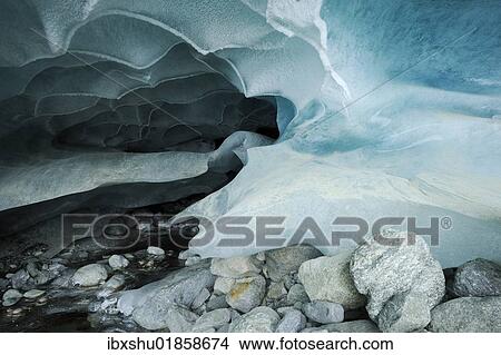 Picture - "Natural ice cave in the Zinal Glacier, Zinal, Valais, Switzerland, Europe". Fotosearch