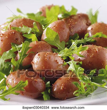 New potatoes and rocket leaves salad with a mustard dressing View Large Photo Image Picture - New potatoes and rocket leaves salad with a mustard dressing. Fotosearch