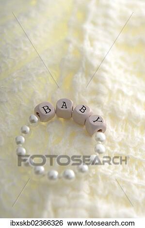 Newborn bracelet with the word Baby View Large Photo Image Stock Photograph - Newborn bracelet with the word Baby. Fotosearch