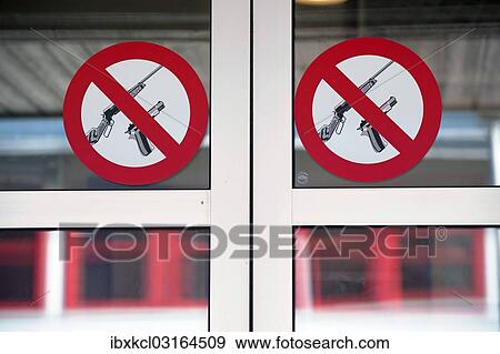 Stock Photo - "No weapons, prohibition sign at the entrance of an official building, Longyearbyen, Spitsbergen Island, Svalbard Archipelago, Svalbard and Jan Mayen, Norway, Europe". Fotosearch