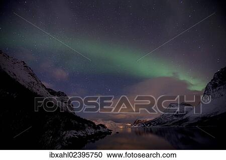 Stock Image - "Northern Lights over the Grotfjord in winter, Kvaloya, Tromso, Norway, Europe". Fotosearch