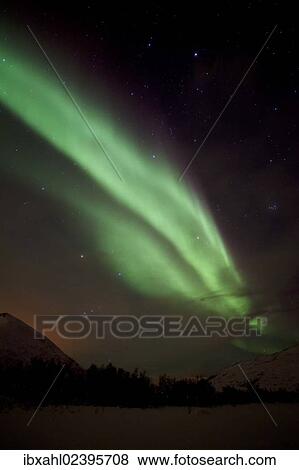 Stock Photo - "Northern Lights over the Kattfjord pass in winter, Kvaloya, Tromso, Norway, Europe". Fotosearch