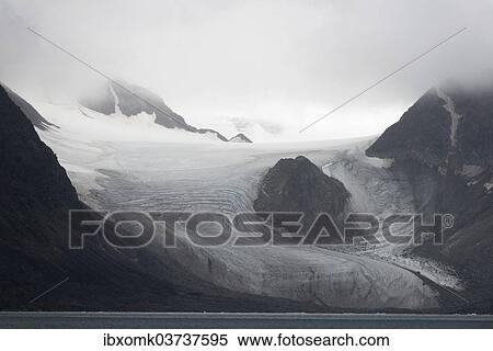 "Nunatak or mountain poking out from the glacier, Kongsbreen Glacier, Kongsfjorden, Spitsbergen Island, Svalbard Archipelago, Svalbard and Jan Mayen, Norway, Europe" View Large Photo Image Stock Photography - "Nunatak or mountain poking out from the glacier, Kongsbreen Glacier, Kongsfjorden, Spitsbergen Island, Svalbard Archipelago, Svalbard and Jan Mayen, Norway, Europe". Fotosearch