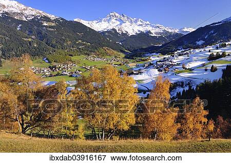 "Oberhalbstein in autumn with the villages Cunter, Savognin, Parsonz, behind the snowy Piz d'Err, Graubunden, Switzerland, Europe" View Large Photo Image Stock Photo - "Oberhalbstein in autumn with the villages Cunter, Savognin, Parsonz, behind the snowy Piz d'Err, Graubunden, Switzerland, Europe". Fotosearch