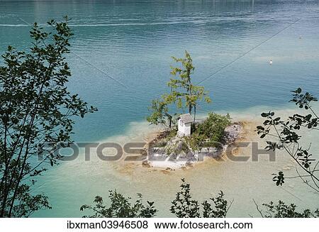 Stock Photo - "Ochsenkreuz shrine on small island in Lake Wolfgangsee, Sankt Gilgen am Wolfgangsee, Salzkammergut, Salzburg state, Salzburg State, Austria, Europe". Fotosearch