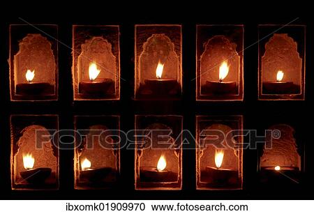Stock Image - "Oil lamps in wall niches, Mool Sagar Heritage Hotel near Jaisalmer, Rajasthan, India, Asia". Fotosearch
