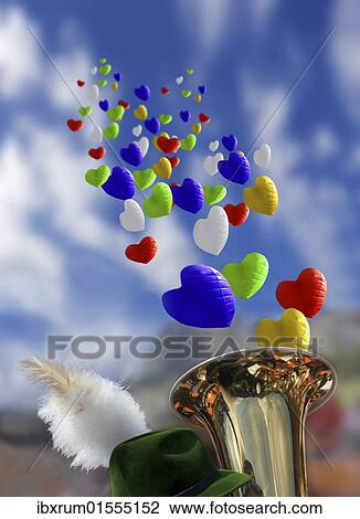 Stock Image - "Oktoberfest mood with Bavarian brass band, feathered hat and balloons". Fotosearch