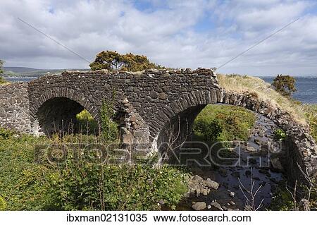 Stock Photography - "Old bridge on the coast, Glenariff, Glens of Antrim, County Antrim, Northern Ireland, Ireland, Great Britain, Europe". Fotosearch
