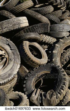 "Old car tyres, material for recycling" View Large Photo Image Stock Image - "Old car tyres, material for recycling". Fotosearch