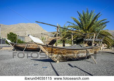 Stock Photography - "Old dhows in front of Khasab fort, Khasab, Musandam, Oman, Asia". Fotosearch