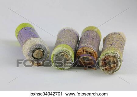 Stock Image - Old leaking batteries. Fotosearch