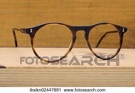 Old reading glasses on a book View Large Photo Image Stock Image - Old reading glasses on a book. Fotosearch