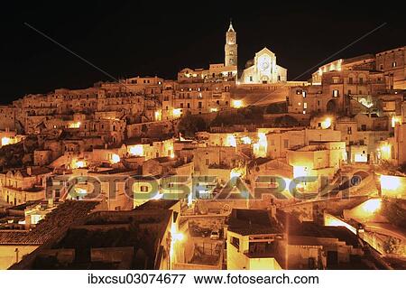 "Old town of Sassi di Matera, consisting partly of cave dwellings, at night, Matera, Basilicata, Italy, Europe" View Large Photo Image Stock Photo - "Old town of Sassi di Matera, consisting partly of cave dwellings, at night, Matera, Basilicata, Italy, Europe". Fotosearch