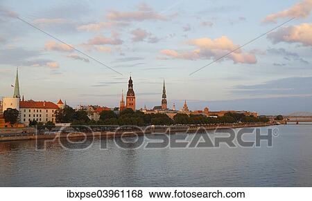 "Old town with the banks of the Daugava River, Riga Castle, Riga Cathedral, St. Peter's Church, from the Vansu Bridge or Vansu tilts over Daugava, Riga, Latvia, Europe" View Large Photo Image Stock Photo - "Old town with the banks of the Daugava River, Riga Castle, Riga Cathedral, St. Peter's Church, from the Vansu Bridge or Vansu tilts over Daugava, Riga, Latvia, Europe". Fotosearch