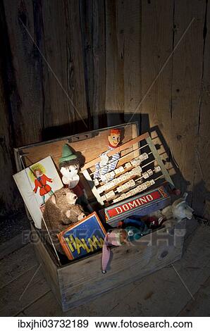 Old toys in a wooden chest View Large Photo Image Stock Photo - Old toys in a wooden chest. Fotosearch
