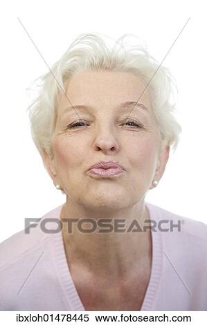 Stock Photography - Old woman pursing her lips. Fotosearch