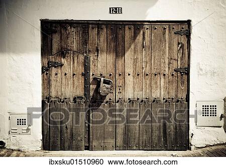 Stock Image - "Old wooden door with a large padlock, Bogota, Colombia, South America". Fotosearch