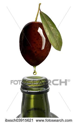 "Olive oil dripping from an olive into a bottle, bottleneck" View Large Photo Image Stock Image - "Olive oil dripping from an olive into a bottle, bottleneck". Fotosearch