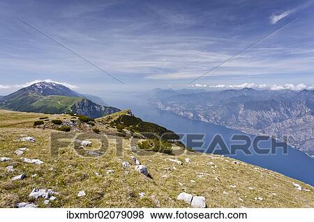 Stock Photo - "On Mt Altissimo, above Nago-Torbole, Lake Garda below, Mt Baldo in the back, Trentino, Italy, Europe". Fotosearch