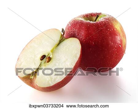 One whole and one cut Red Discovery apple View Large Photo Image Picture - One whole and one cut Red Discovery apple. Fotosearch