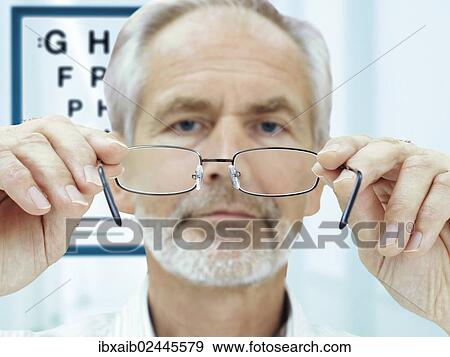 "Optician, ophthalmologist" View Large Photo Image Stock Photo - "Optician, ophthalmologist". Fotosearch
