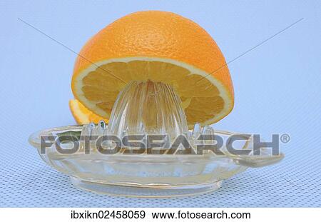 "Orange juicer made of glass, half an orange" View Large Photo Image Stock Photo - "Orange juicer made of glass, half an orange". Fotosearch