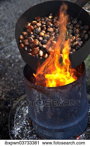 Organic chestnuts being roasted View Large Photo Image Stock Image - Organic chestnuts being roasted. Fotosearch