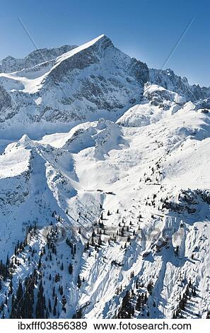 "Osterfelder ski slope, Hochalm, Alpspitze mountain, Wetterstein mountain range, Garmisch-Partenkirchen, Upper Bavaria, Bavaria, Germany, Europe" View Large Photo Image Stock Photo - "Osterfelder ski slope, Hochalm, Alpspitze mountain, Wetterstein mountain range, Garmisch-Partenkirchen, Upper Bavaria, Bavaria, Germany, Europe". Fotosearch