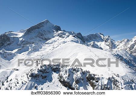 "Osterfelder ski slope, Langenfelder ski slope, Hochalm, Hochalmbahn cable car, Alpspitze mountain and Zugspitze mountain, Wetterstein mountain range, Garmisch-Partenkirchen, Bavaria, Germany, Europe" View Large Photo Image Stock Image - "Osterfelder ski slope, Langenfelder ski slope, Hochalm, Hochalmbahn cable car, Alpspitze mountain and Zugspitze mountain, Wetterstein mountain range, Garmisch-Partenkirchen, Bavaria, Germany, Europe". Fotosearch