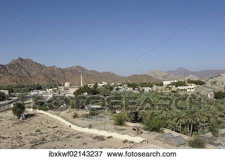 "Overblick of the oasis and Arab enclave of Hatta with a mosque and palm trees, with the Hajar Mountains on the horizon, United Arab Emirates, Arabian Peninsula, Middle East, Asia" View Large Photo Image Stock Photo - "Overblick of the oasis and Arab enclave of Hatta with a mosque and palm trees, with the Hajar Mountains on the horizon, United Arab Emirates, Arabian Peninsula, Middle East, Asia". Fotosearch