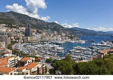 Stock Photo - "Overlooking the harbour of Monaco, Port Hercule, Monte Carlo, principality of Monaco, Cote d'Azur, Mediterranean, Europe, PublicGround". Fotosearch