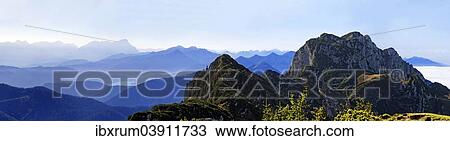 "Panorama from the Benediktenwand ridge and the Achselkopfen in the foreground with a view of the Zugspitze and Jachenau with Walchensee, Lenggries, Upper Bavaria, Bavaria, Germany, Europe" View Large Photo Image Stock Image - "Panorama from the Benediktenwand ridge and the Achselkopfen in the foreground with a view of the Zugspitze and Jachenau with Walchensee, Lenggries, Upper Bavaria, Bavaria, Germany, Europe". Fotosearch