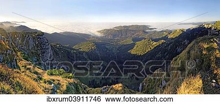 "Panorama from the Benediktenwand ridge to the Tutzinger hut and Alpine foreland country in fog, from Benediktbeuern, Upper Bavaria, Bavaria, Germany, Europe" View Large Photo Image Stock Photograph - "Panorama from the Benediktenwand ridge to the Tutzinger hut and Alpine foreland country in fog, from Benediktbeuern, Upper Bavaria, Bavaria, Germany, Europe". Fotosearch