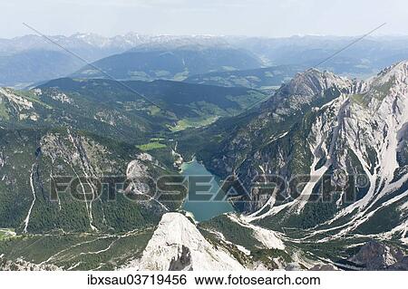 "Panoramic view of the Alps from the peak of Mt Seekofel towards the north with Pragser Wildsee Lake, Dolomiti di Braies, South Tyrol province, Trentino-Alto Adige, Italy, Europe" View Large Photo Image Stock Photograph - "Panoramic view of the Alps from the peak of Mt Seekofel towards the north with Pragser Wildsee Lake, Dolomiti di Braies, South Tyrol province, Trentino-Alto Adige, Italy, Europe". Fotosearch
