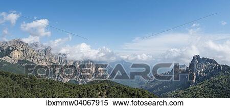 "Panoramic view over a valley, mountain slopes with rocky peaks surrounded by pine forests, cliffs, Col de Bavella, Bavella Massif, Corsica, France, Europe" View Large Photo Image Stock Photography - "Panoramic view over a valley, mountain slopes with rocky peaks surrounded by pine forests, cliffs, Col de Bavella, Bavella Massif, Corsica, France, Europe". Fotosearch
