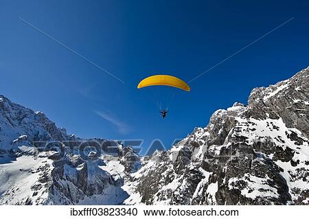 "Paraglider, Hollental or Hell Valley, Hollentalferner glacier, Waxensteinkamm crest, Zugspitze mountain, Wetterstein mountains, Grainau, Werdenfelser Land, Bavaria, Germany, Europe" View Large Photo Image Stock Image - "Paraglider, Hollental or Hell Valley, Hollentalferner glacier, Waxensteinkamm crest, Zugspitze mountain, Wetterstein mountains, Grainau, Werdenfelser Land, Bavaria, Germany, Europe". Fotosearch