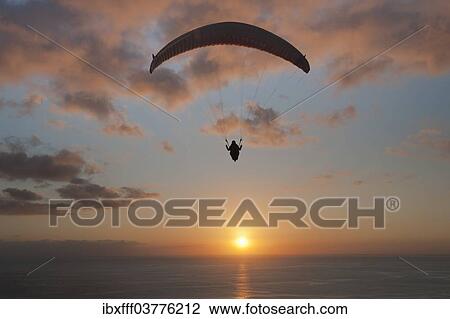 "Paraglider over the Atlantic Ocean with sunset, Canary Islands, Spain, Europe" View Large Photo Image Stock Image - "Paraglider over the Atlantic Ocean with sunset, Canary Islands, Spain, Europe". Fotosearch