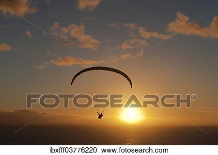 "Paraglider over the Atlantic Ocean with sunset, Canary Islands, Spain, Europe" View Large Photo Image Stock Image - "Paraglider over the Atlantic Ocean with sunset, Canary Islands, Spain, Europe". Fotosearch