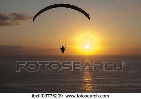 "Paraglider over the Atlantic Ocean with sunset, Canary Islands, Spain, Europe" View Large Photo Image Stock Photo - "Paraglider over the Atlantic Ocean with sunset, Canary Islands, Spain, Europe". Fotosearch