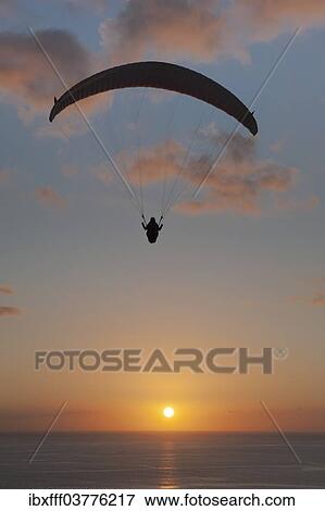 "Paraglider over the Atlantic Ocean with sunset, Canary Islands, Spain, Europe" View Large Photo Image Stock Photo - "Paraglider over the Atlantic Ocean with sunset, Canary Islands, Spain, Europe". Fotosearch