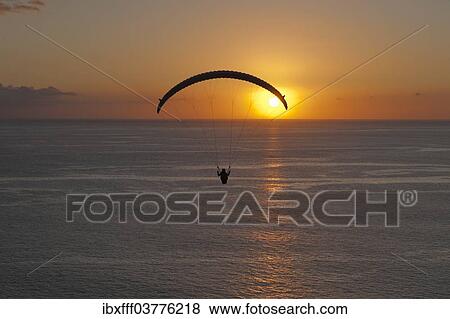 "Paraglider over the Atlantic Ocean with sunset, Canary Islands, Spain, Europe" View Large Photo Image Stock Photo - "Paraglider over the Atlantic Ocean with sunset, Canary Islands, Spain, Europe". Fotosearch